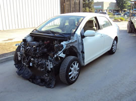 2009 TOYOTA YARIS 4 DOOR SEDAN 1.5L AT FWD COLOR WHITE  Z13469